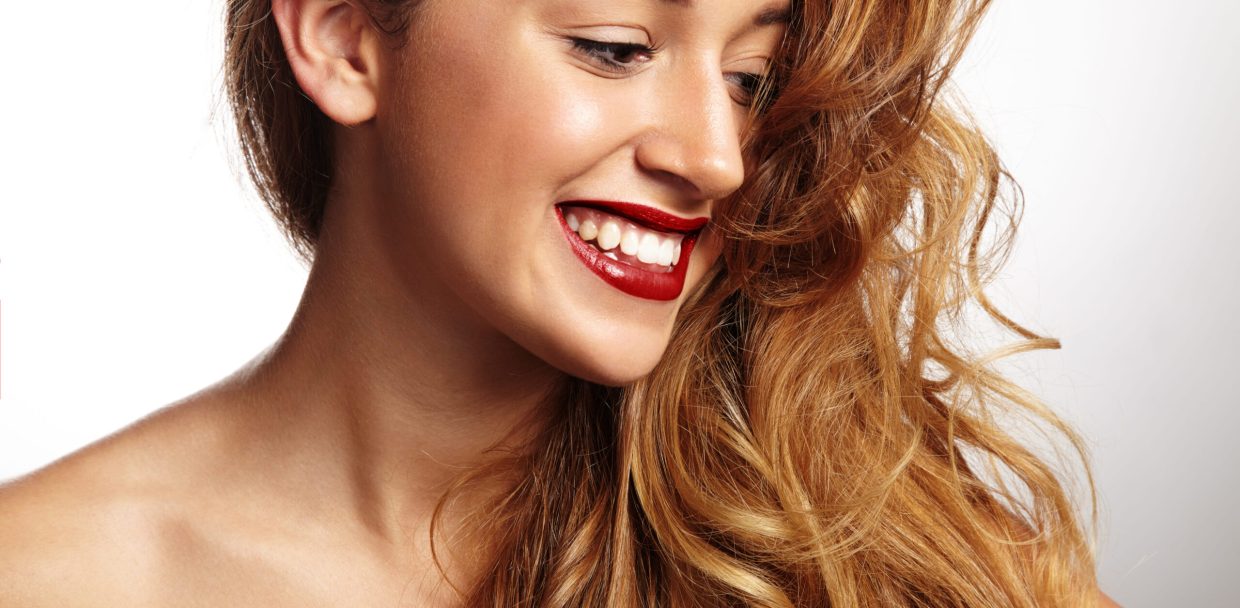 smiling-woman-with-red-lips-watching-aside-1